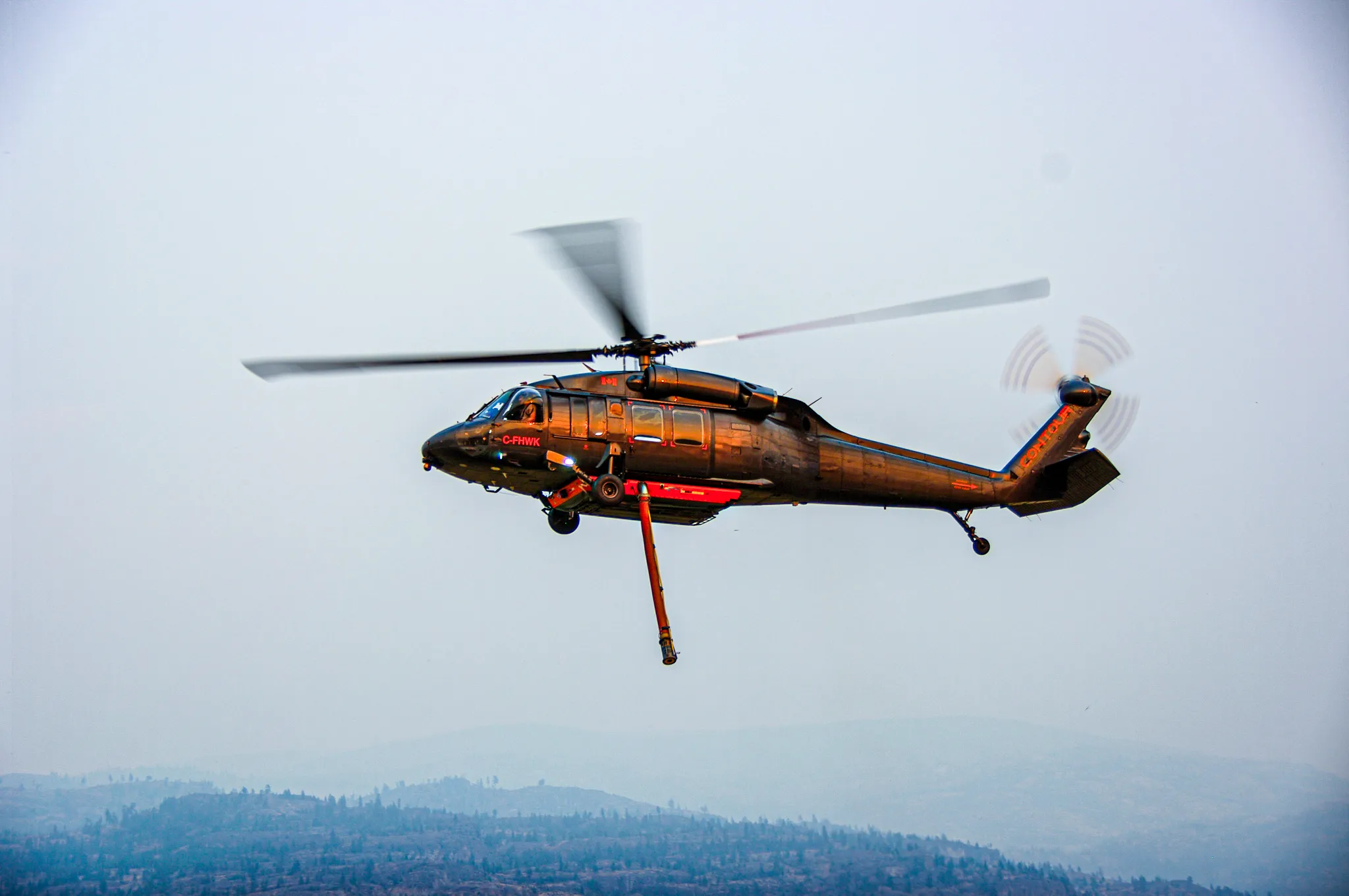 A Contour helicopter in flight, equipped with VoxVision and firefighting equipment