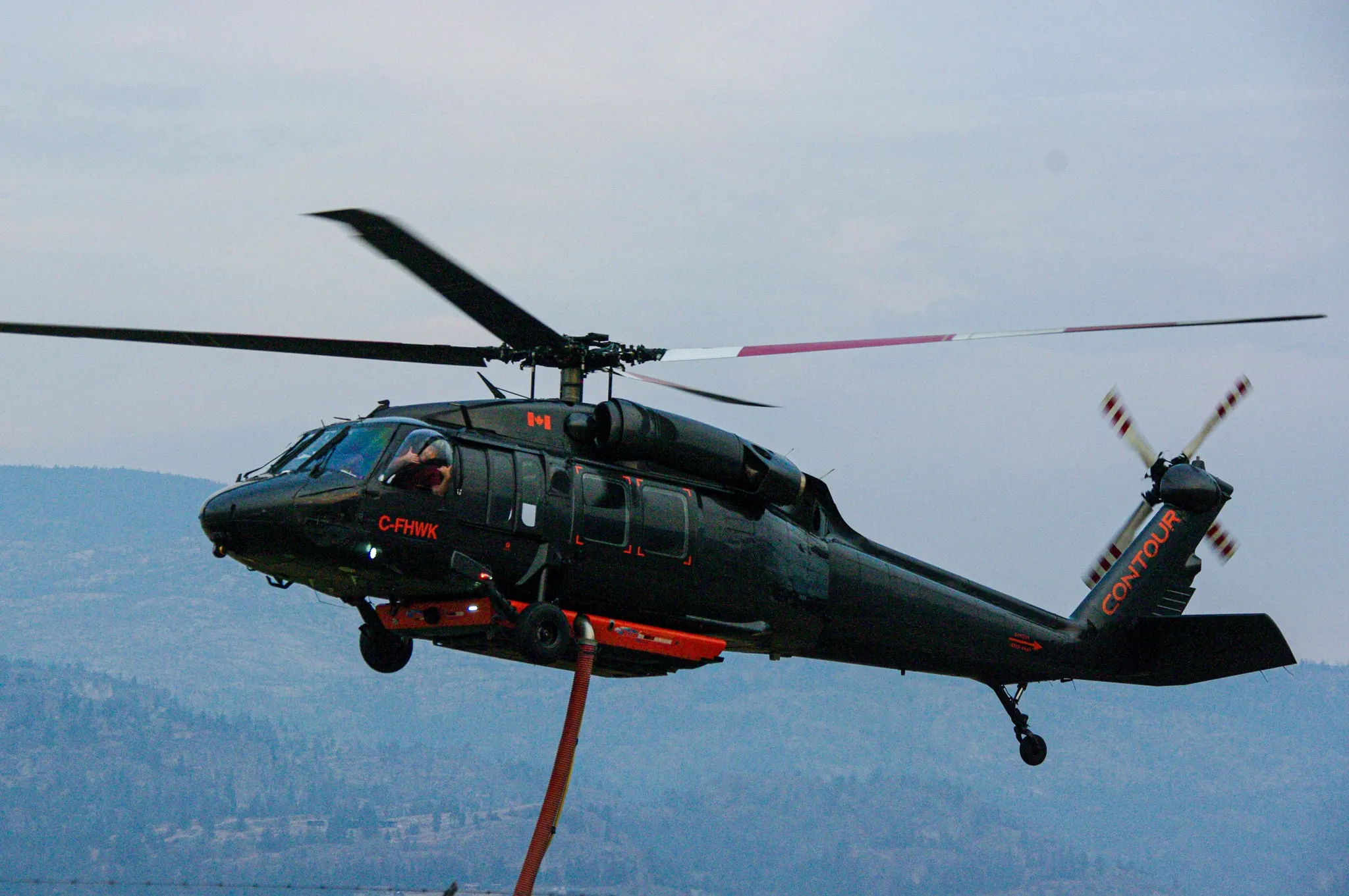 A Contour helicopter in flight, equipped with VoxVision and firefighting equipment